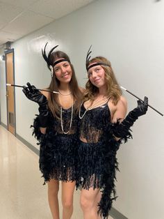 two women dressed up in costumes posing for the camera