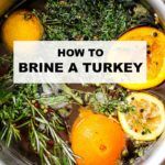 oranges and herbs in a pot with the words how to brine a turkey