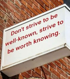 a sign on the side of a building that says don't strive to be well - known, strive to be worthing