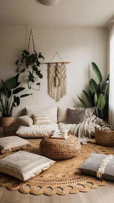 a living room filled with lots of furniture and plants