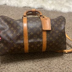 Louis Vuitton Keepall 45. Does Have Water Markers On Leather. Missing A Button.(Shown In Picture) No Stains On Inside Of The Bag. No Smells. Louis Vuitton Keepall 45, Keepall 45, Louis Vuitton Keepall, Louis Vuitton Bags, Travel Bags, Louis Vuitton Bag, Markers, Bag Lady, Louis Vuitton