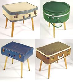 four suitcases sitting on top of wooden legs with different colors and sizes in them