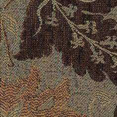 close up view of an intricately designed carpet with leaves and flowers on it's surface