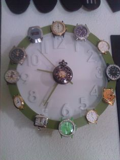 a clock with many different watches around it