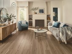 a living room filled with furniture and a fire place in the middle of the room