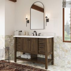 a bathroom vanity with two sinks and a large mirror above it, along with a rug on the floor