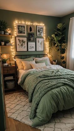 a bedroom decorated in green and white with lights on the wall