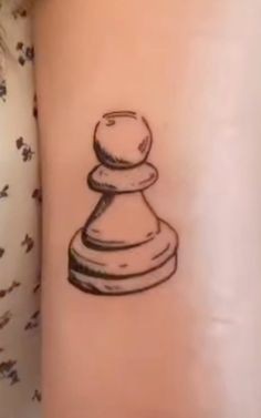 a black and white drawing of a chess piece on the right side of the arm