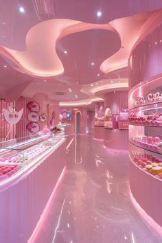 the interior of a pink and white pastry shop