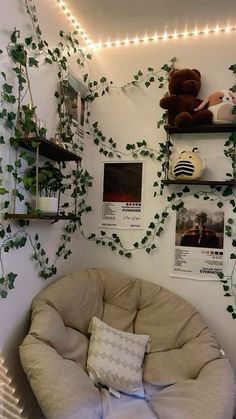 there is a bean bag chair in the corner of this room with ivy growing on the wall