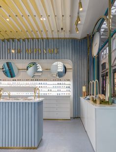 the interior of a jewelry store with mirrors on the wall