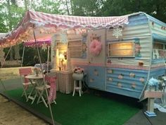 an old trailer is decorated with pink and blue decor for a birthday or baby shower