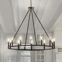 a chandelier hanging from the ceiling in a kitchen