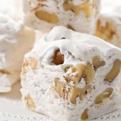 some kind of dessert with icing and nuts on it