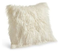 a white fluffy pillow on a white background