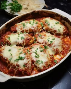 a casserole dish with meatballs and cheese on the top is ready to be eaten