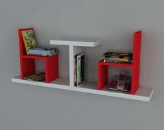 two red and white shelves with books on them