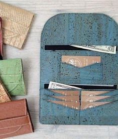 several different types of wallets sitting next to each other on top of a table