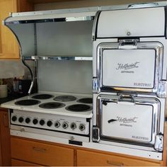 an old fashioned stove and oven in a kitchen