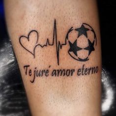 a tattoo that reads, i love you and has a soccer ball in the shape of a heart