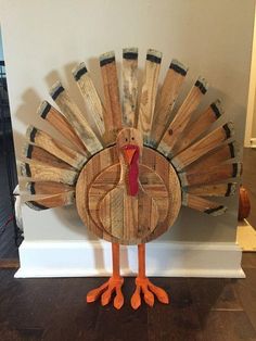 a wooden turkey sitting on top of a table next to a wall with words saying thanksgiving wood turkey $ 40 00 add to cart