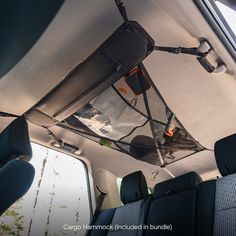 the interior of a vehicle with an overhead net