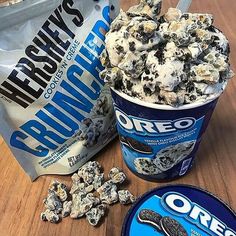 oreo cookies and cream ice cream in a cup next to an oreo bag