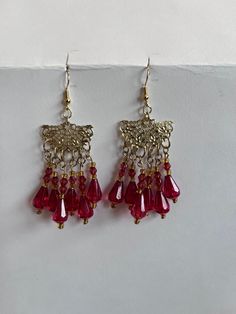 Red and gold dangly chandelier earrings Red Teardrop Chandelier Earrings As Gift, Festive Pierced Chandelier Drop Earrings, Elegant Red Teardrop Beaded Earrings, Festive Chandelier Drop Earrings, Festive Gold Chandelier Earrings With Dangling Beads, Elegant Red Teardrop Chandelier Earrings, Red Vintage Earrings For Celebrations, Gold Chandelier Earrings With Dangling Beads For Festive Occasions, Red Pierced Earrings For Celebration