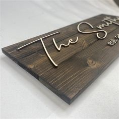 a wooden sign that says live, love, and laugh on it's side