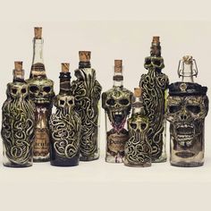 there are many bottles with designs on them