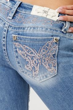 Low-rise, light-wash slim bootcut jeans- Butterfly design in pink and silver embroidery with matching yoke design- Mini silver rhinestone rivets throughout design- White leather logo brand patch- Rhinestone rivets- 5-pocket design- Slight fading Model is wearing size: 26Model Measurements:Height: 5'8"Bust: 35"Waist: 26"Hips: 39" Fabric Content: 52% Cotton, 27% Lyocell, 20% Polyester, 1% Elastane Care: Gentle machine wash inside-out with like colors in cold water. Tumble dry low. Style No. L9330S Luxury Washed Blue Flare Jeans With Five Pockets, Luxury Faded Flare Jeans With Pockets, Luxury Faded Denim Flare Jeans, Cheap Vintage Cutoff Jeans, Luxury Medium Wash Flare Jeans For Summer, Flare Jeans Print, Cheap Fitted Light Wash Flare Jeans, Luxury Faded Flare Jeans, Luxury Women's Jeans With Flap Pockets