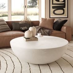 The Lensey Modern Concrete Round Coffee Table features a sleek, minimalistic design with a smooth, rounded form that exudes contemporary elegance. Its all-white or all-black concrete finish offers a striking aesthetic, making it a versatile centerpiece for any living space. The spacious, flat surface is perfect for displaying decor or accommodating drinks and snacks, while the bowl-like shape adds a unique touch to your interior. Orren Ellis Color: White | Orren Ellis Lensey Concrete Round Outdo Round Outdoor Coffee Table, Black Concrete, Stone Concrete, Concrete Finish, Outdoor Coffee Table, Coffee Table White, Outdoor Coffee Tables, Decor Display, Minimalistic Design