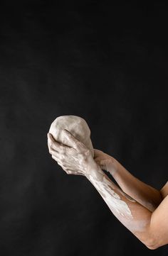 a woman with her hands covered in white powder