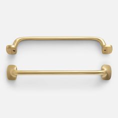 two gold handles on a white background