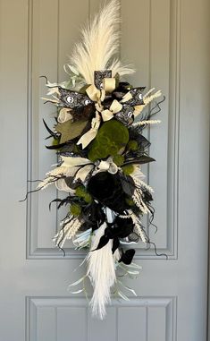 a door decorated with white and black flowers