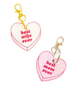 two heart shaped keychains with the words best wife ever and beat mom ever written on them