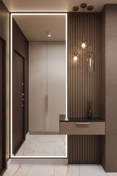 a modern bathroom with marble flooring and brown walls, along with two lights on the wall