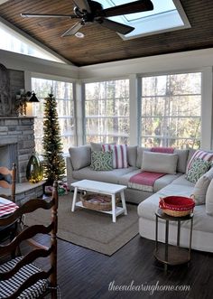 a living room filled with furniture and a fire place