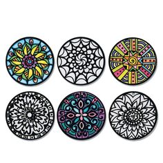 four circular coasters with different designs on them