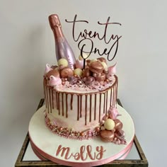 a birthday cake decorated with chocolate and pink icing