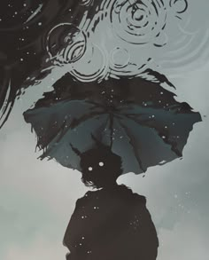 the silhouette of a person holding an umbrella