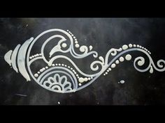 an artistic design on the side of a building in white and black with swirls