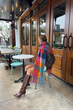 Made from recycled fabric and designed for layering in cold weather the Leah Scarf is our oversized, ultra soft blanket scarf with a colored plaid pattern and loose fringe ends. Wrap the Leah Scarf around once or twice for a luxe, blanketed look. Colorful Scarf Outfit, Scarf Aesthetic, How To Wear A Blanket Scarf, Winter Nyc, Checkered Scarf, Big Scarf, Rainbow Scarf, Apt Ideas, Oversized Blanket