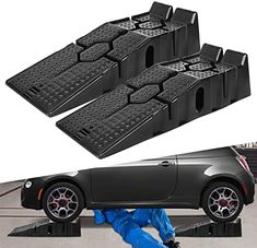 three black car steps with one person laying on the ground next to it and another in blue