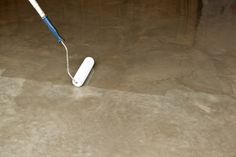 a toothbrush is laying on the floor in an empty room