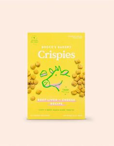 a bag of crispies next to a yellow box on a white tablecloth