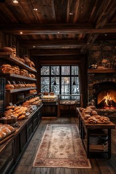 a bakery filled with lots of breads and pastries next to a fire place