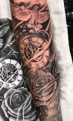 a man's arm with tattoos on it and an open pocket watch in the middle