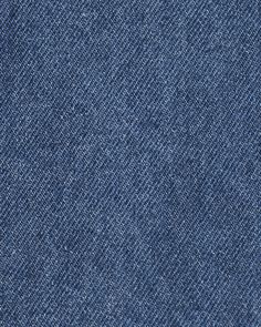 the back side of a blue denim fabric textured with white stitchs and small holes