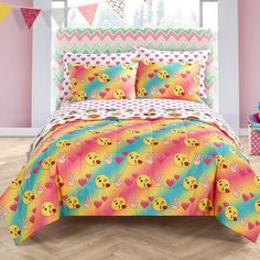 the bed is decorated with colorful emoticions and hearts